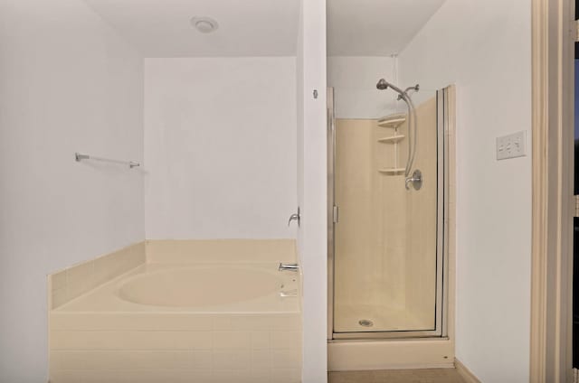 bathroom with separate shower and tub