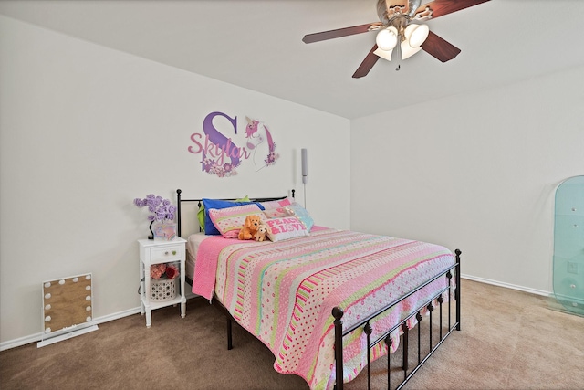 bedroom featuring carpet floors, baseboards, and a ceiling fan