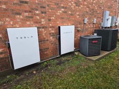 exterior details featuring brick siding and central air condition unit