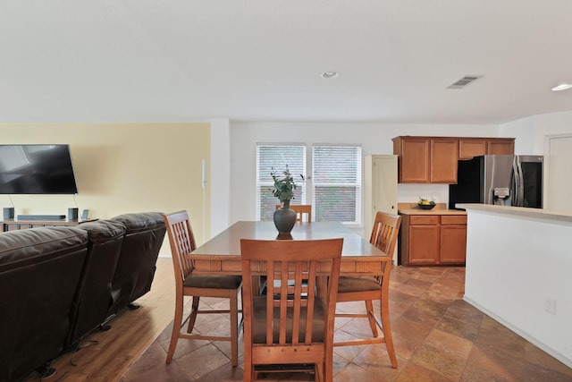 dining space featuring visible vents and recessed lighting