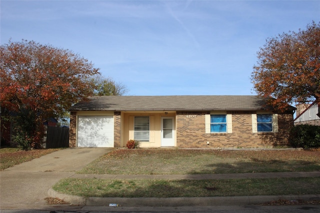 single story home featuring a front lawn and a garage