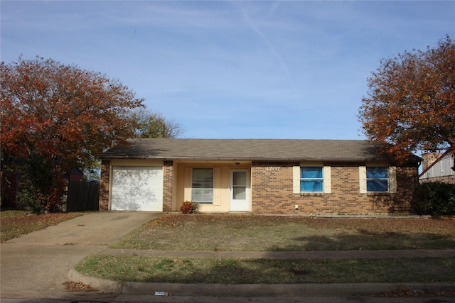 single story home with a garage and a front yard