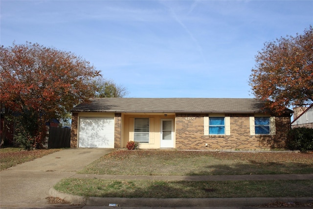 single story home featuring a front yard and a garage