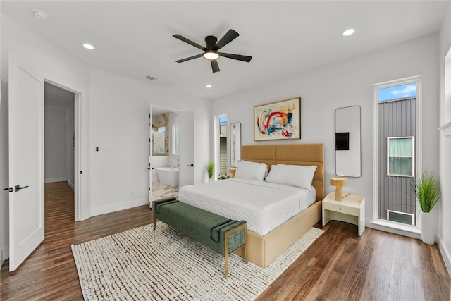 bedroom featuring ensuite bathroom, ceiling fan, and dark hardwood / wood-style floors