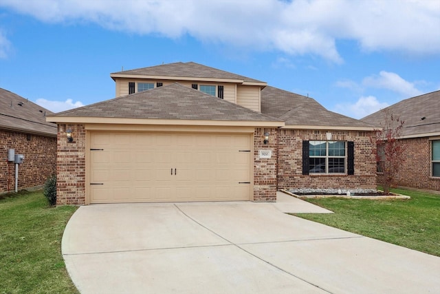 view of front of home featuring a garage and a front lawn