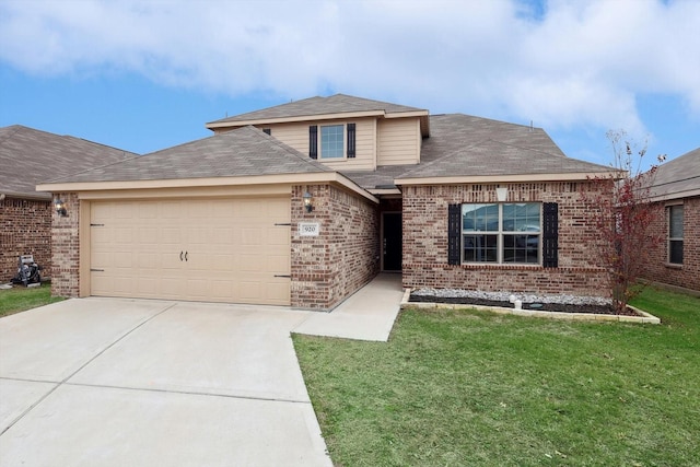 view of front facade with a front yard and a garage