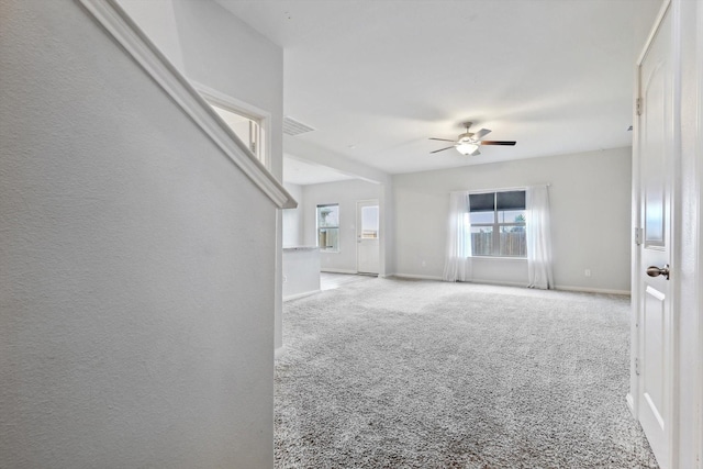 carpeted empty room with ceiling fan