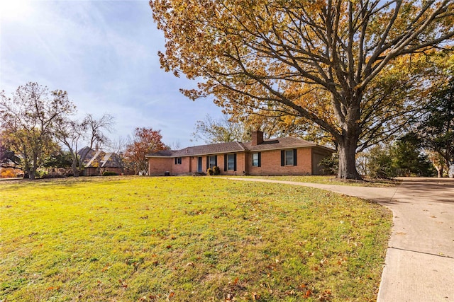 ranch-style house with a front yard