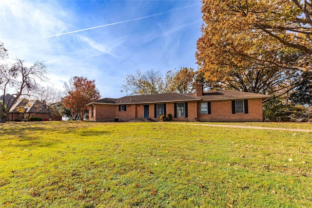 ranch-style home with a front yard