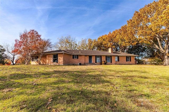 ranch-style house with a front lawn