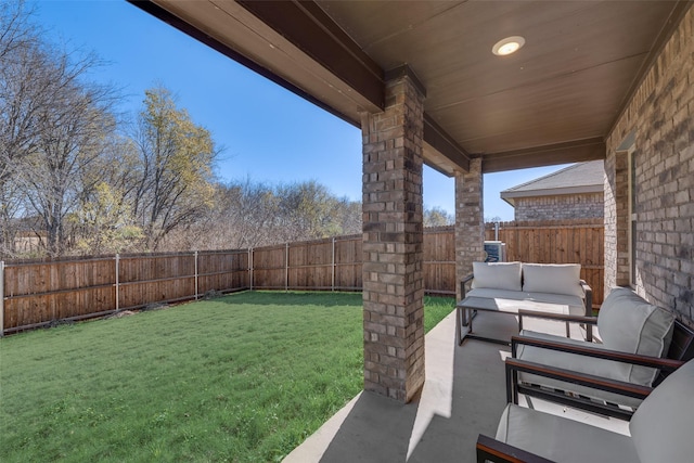 view of yard with an outdoor living space and a patio area