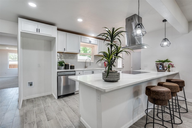 kitchen featuring sink, hanging light fixtures, stainless steel dishwasher, island exhaust hood, and white cabinets