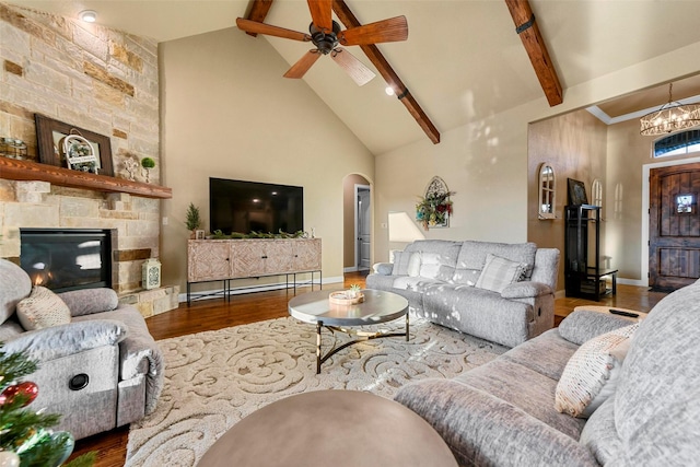 living room featuring beamed ceiling, high vaulted ceiling, and hardwood / wood-style flooring