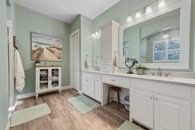 bathroom featuring vanity and hardwood / wood-style flooring