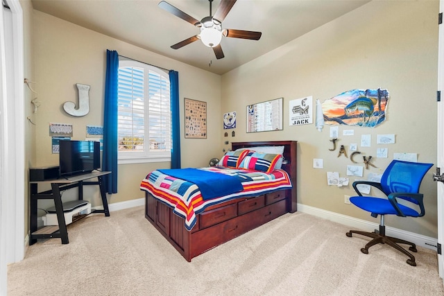 carpeted bedroom with ceiling fan