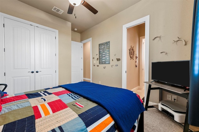 bedroom featuring carpet floors, a closet, and ceiling fan