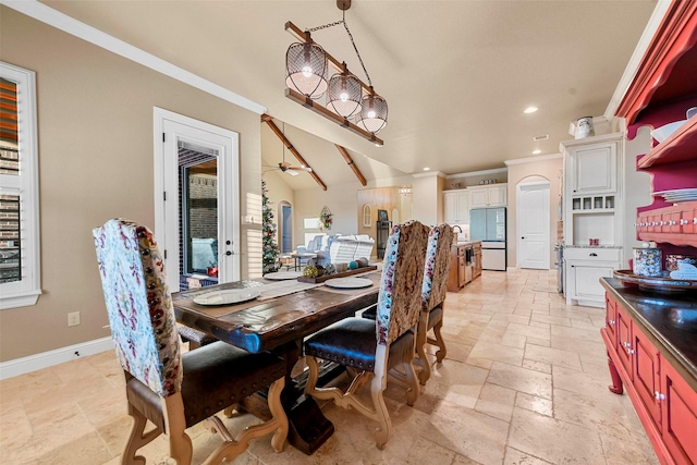 dining space with ornamental molding