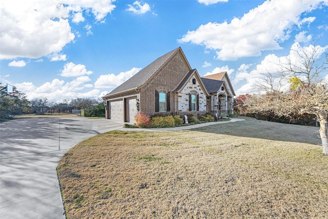 view of front facade with a front yard and a garage