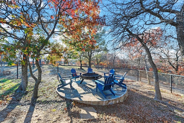 view of yard with an outdoor fire pit and a patio area