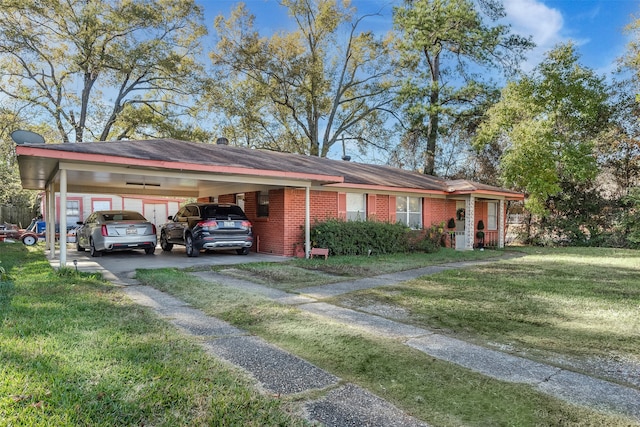 view of front of house with a front yard and a carport