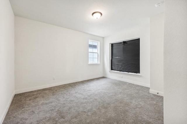 empty room with light colored carpet