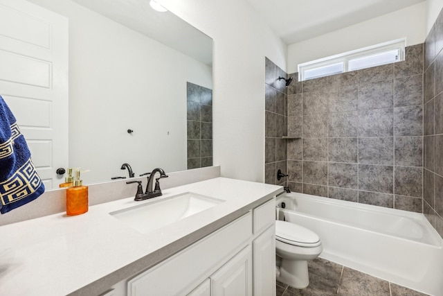 full bathroom with vanity, toilet, tiled shower / bath combo, and tile patterned flooring