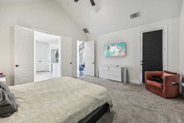 carpeted bedroom with connected bathroom, high vaulted ceiling, a walk in closet, ceiling fan, and a closet