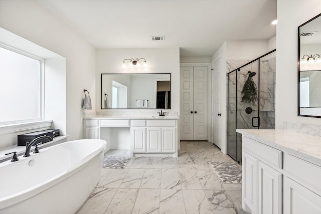 bathroom featuring plus walk in shower and vanity