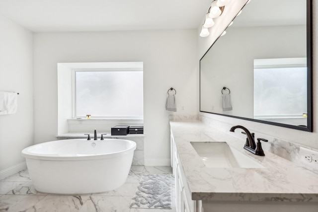 bathroom with vanity and a tub to relax in