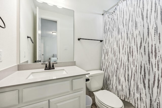 full bathroom with shower / bathtub combination with curtain, vanity, and toilet