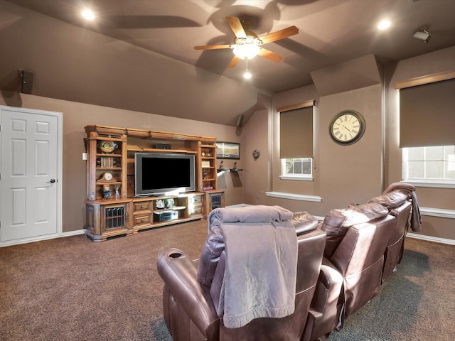 cinema featuring ceiling fan, lofted ceiling, and dark colored carpet