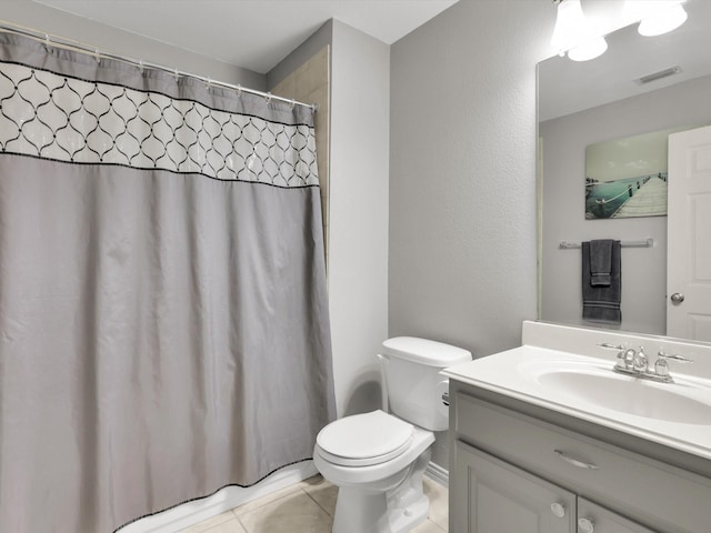 bathroom with tile patterned flooring, vanity, a shower with shower curtain, and toilet