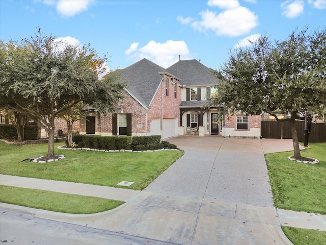 view of front of house featuring a garage and a front lawn