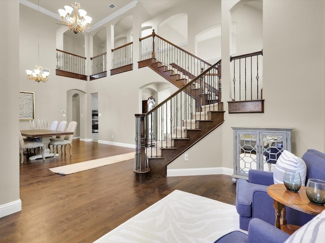 interior space featuring an inviting chandelier and dark wood-type flooring