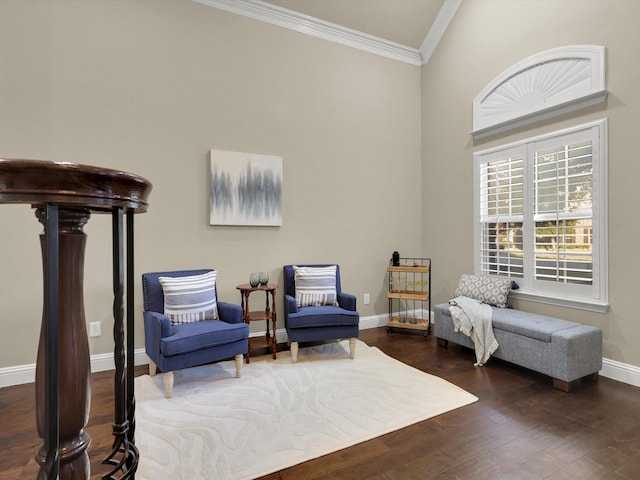 living area featuring ornamental molding and dark hardwood / wood-style floors