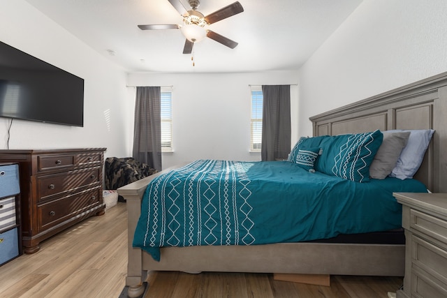 bedroom featuring light wood-style floors and a ceiling fan