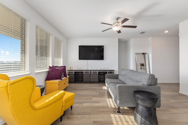 living area featuring visible vents, recessed lighting, a ceiling fan, and wood finished floors