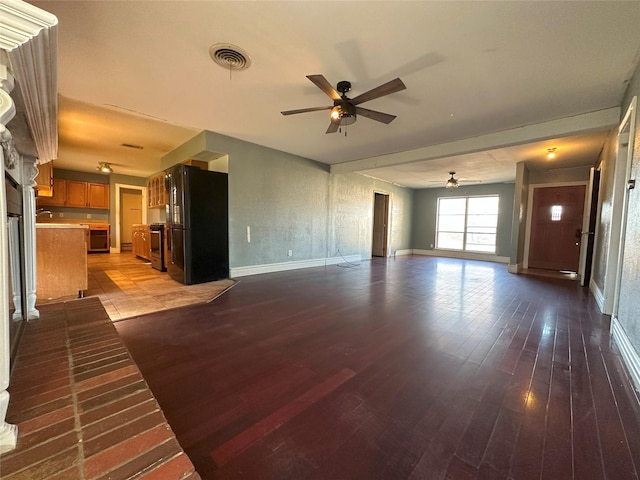 unfurnished living room with ceiling fan and light hardwood / wood-style floors