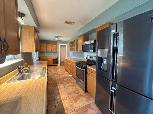 kitchen featuring stainless steel appliances and sink