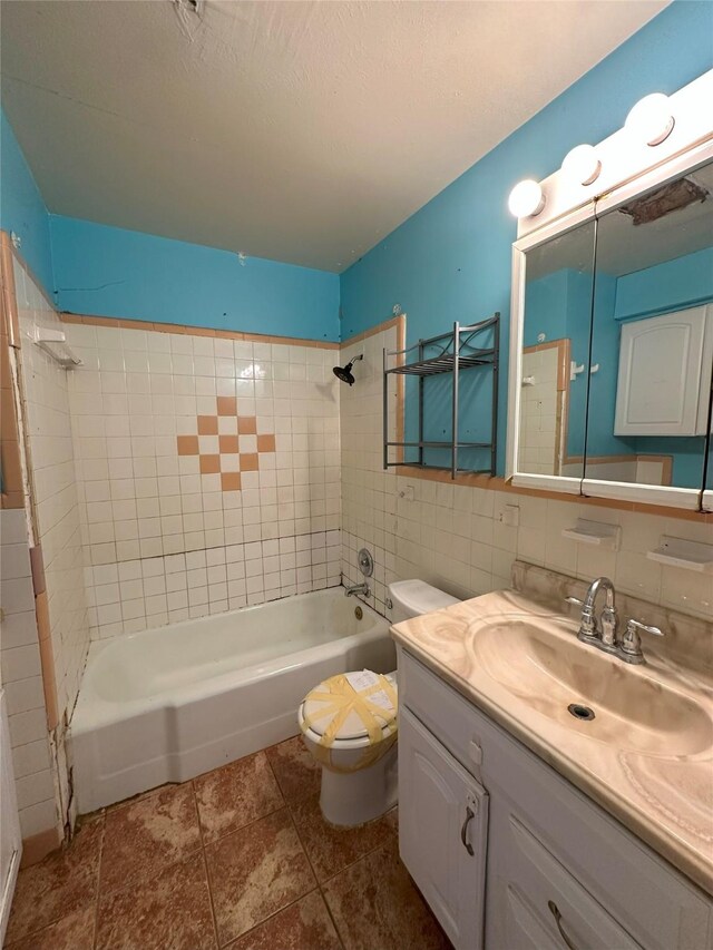 full bathroom with decorative backsplash, tile patterned floors, tile walls, toilet, and tiled shower / bath