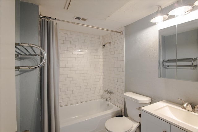 full bathroom featuring vanity, toilet, and tiled shower / bath