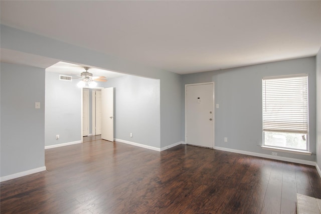 unfurnished room featuring ceiling fan and dark hardwood / wood-style flooring