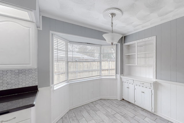 unfurnished dining area with light hardwood / wood-style floors