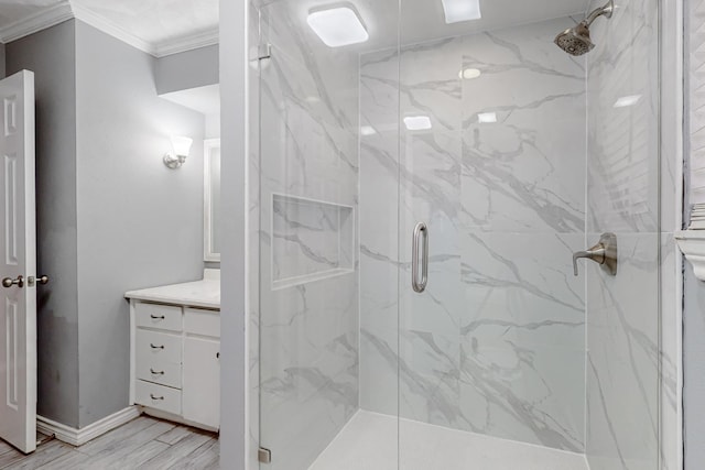 bathroom featuring ornamental molding, an enclosed shower, hardwood / wood-style floors, and vanity