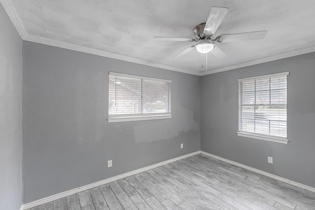 empty room featuring ceiling fan, ornamental molding, light hardwood / wood-style floors, and a healthy amount of sunlight