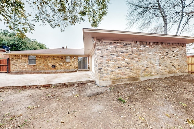 back of house with a patio