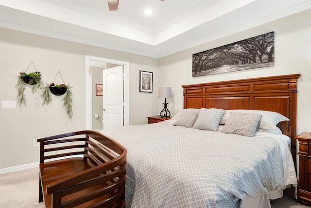 bedroom featuring carpet, crown molding, and ensuite bath