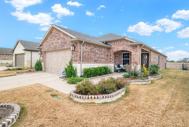 ranch-style house with a garage and a front lawn