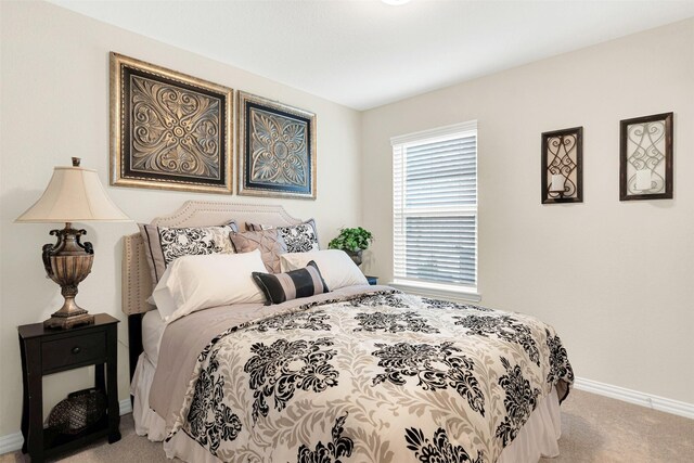 bedroom with light colored carpet