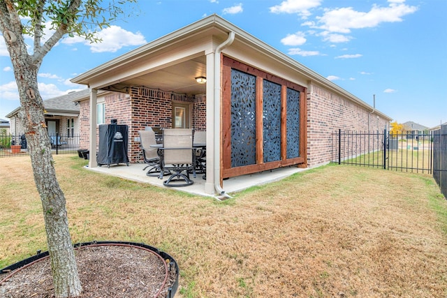 exterior space featuring a yard and a patio